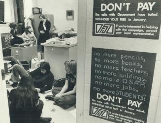 Students Occupying the registrar's office at Glendon College of York University talk and play cards to pass the time