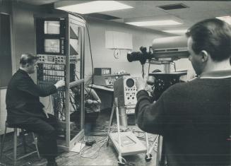 A lecture is beamed to classrooms from closed-circuit TV studio