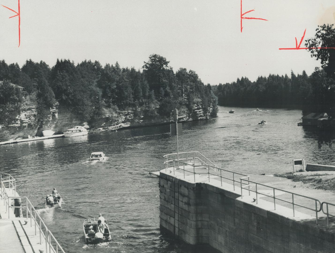 Ontario holiday: The Kawarthas, Pleasure boats cruise toward Sturgeon Lake after leaving lock 34 of the Trent waterway system at Fenelon Falls in Ontario's picturesque Kawartha Lakes region