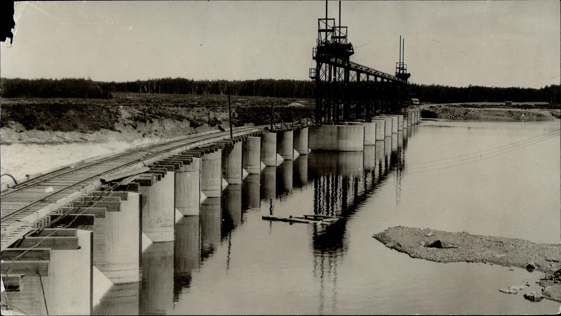 Typical of the northward development of Ontario is the new power dam at Smokey Falls on the Metagami river