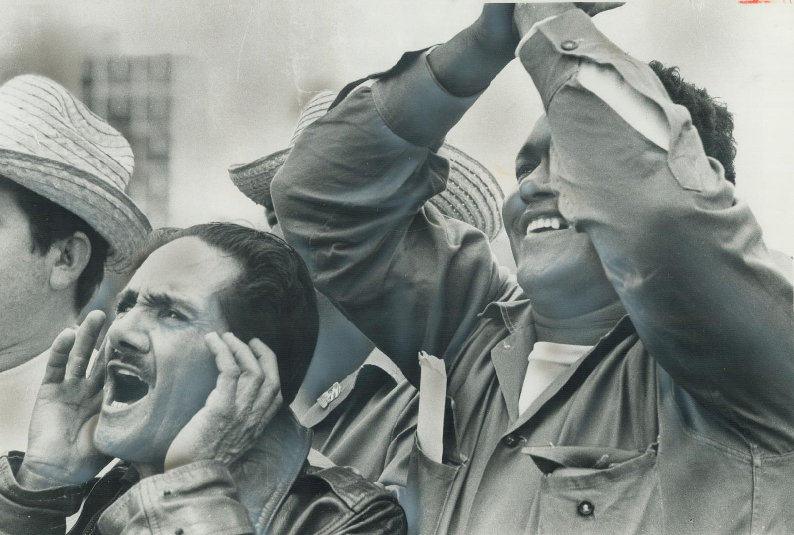 Cuban workers applaud Castro even though he has just warned them that tough times are ahead