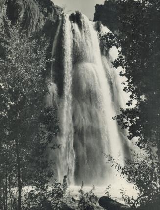 This ninety-foot shower with a September Morn figure at the foot of it is Havasu Falls in the canyon reservation of the Havasupai Indians in Arizona. [Incomplete]