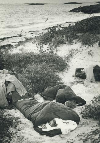 6 A.M. Sleeping under open sky Marthe Dupuis, (L) and Sylvie Richard on sand