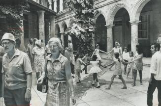 Adian Tourists in Cuba, seen passing a school in old Havana, are part of a test program by the government, which wants visitors but is determined that(...)