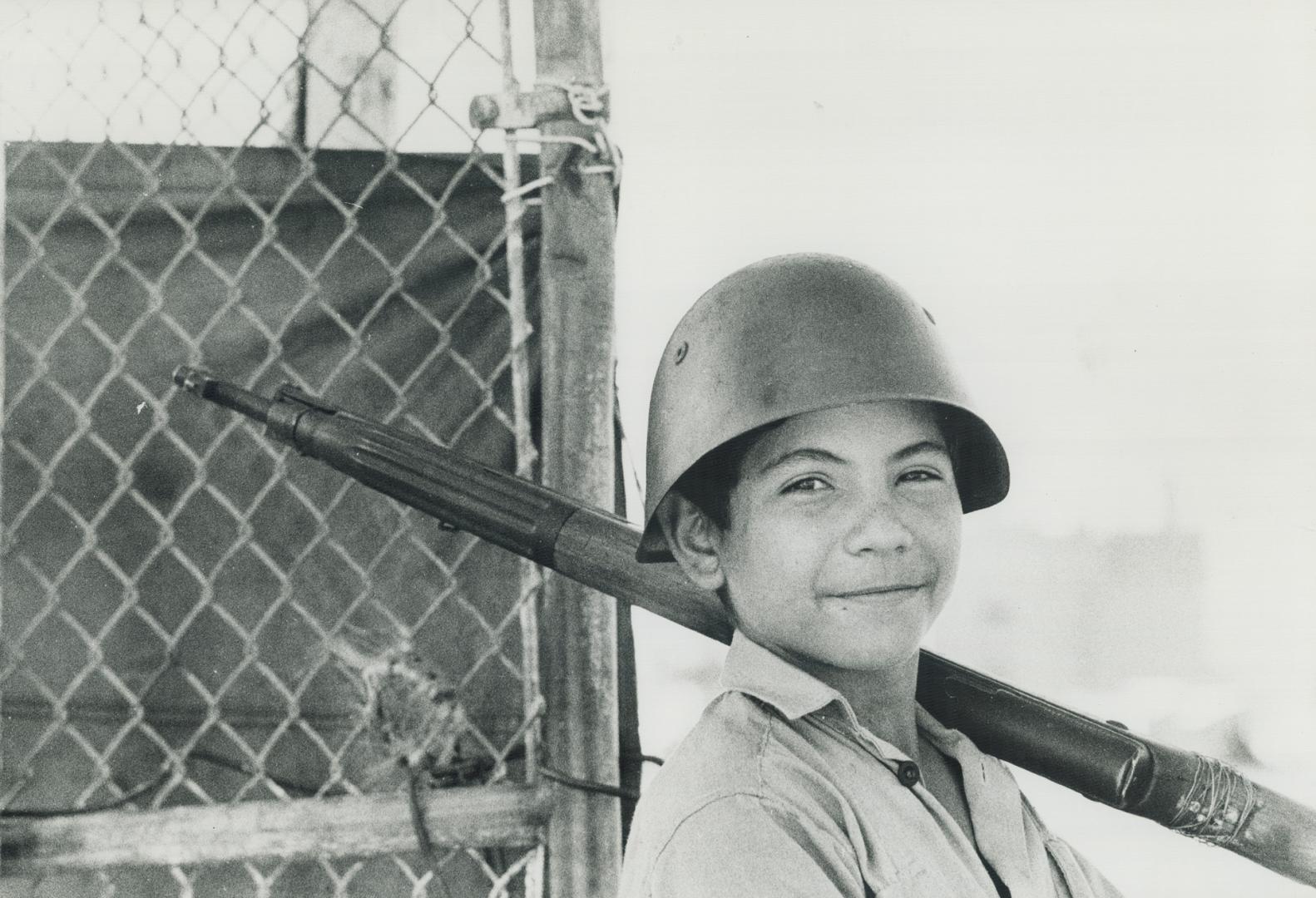 Boy bearing guard duty outside Battista's old prison on Isle of Prines 1972