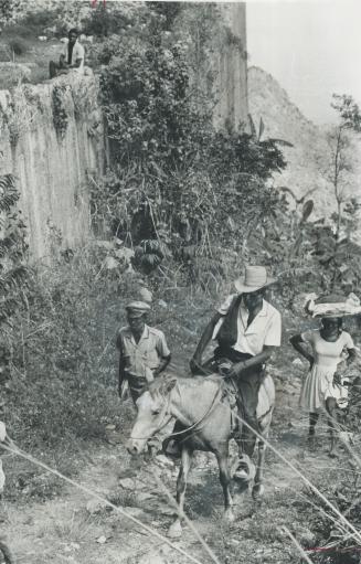 Mountain roads in Haiti are often rocky lanes like this or bone-jarring, potholed pavements