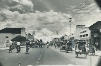 People in Jogjakarta depend chiefly on pedal power to get around this city in the lushness of Indonesia