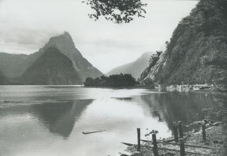 The quiet waters of Milford Sound are only one of the attractions drawing tourists at new low currency rates to New Zealand