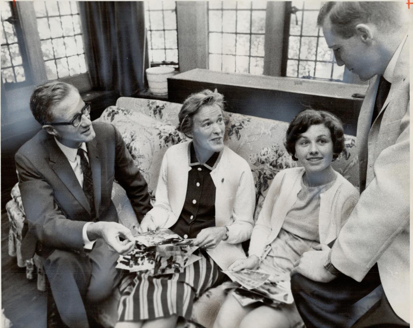 Refreshing their memories: Dr. and Mrs. Hennan Middlekoop (left) and Mr. and Mrs. Ronald McGraw go over some of the photographs they took while operat(...)