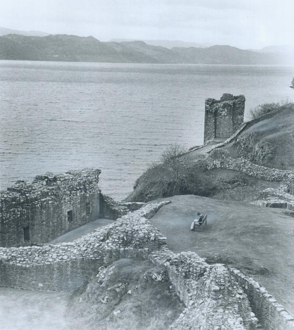 On Monster Watch beside Loch Ness, this tourist sits reading amidst the ruins of an old castle and waits hopefully for a sign of Nessie, one of the mo(...)