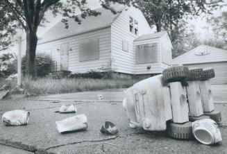 Abandoned home: A boarded-up house, abandoned when chemical contamination turned Love Canal into a no-man's-land two years ago, awaits the all-clear that could bring it back to life