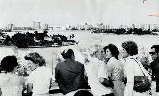 Some cruises keep you port hopping, Cruise ship passengers line the rail to catch a good view of San Juan as their vessel prepares to enter the inner harbor