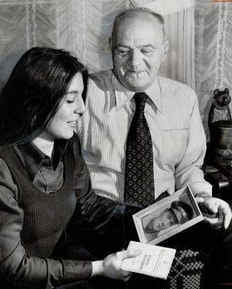 Piece of history: Bill Patryluk shows Spanish Civil War mementos to his daughter Rosanne, including an old photograph of him in the uniform of the Mackenzie-Papineau Battalion