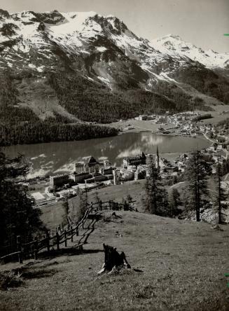 St. Mortiz, famous Swiss resort in the upper Engadine, sheds its coat of white for the green finery of summer