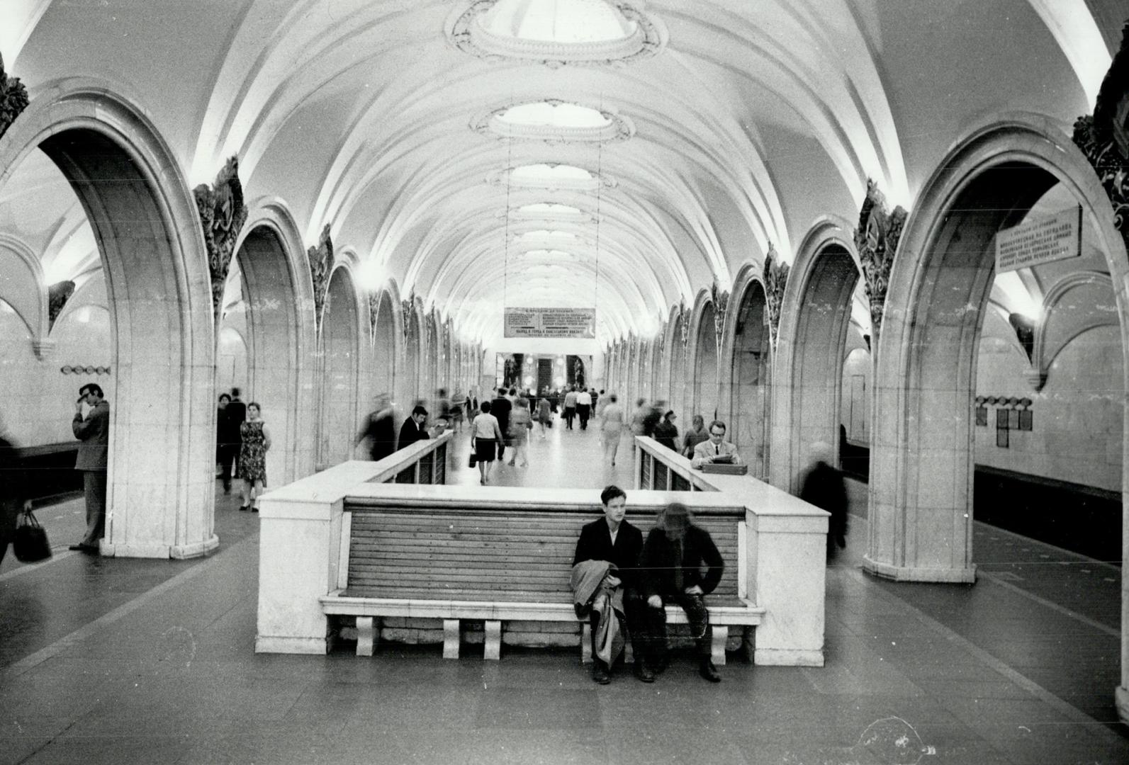 This is no czarist palace but a Moscow subway station, complete with marble, mosaics and crystal chandeliers