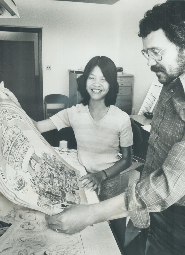 Artist to artist: Melinda Wong, 14, shows Star staff cartoonist Victor Roschkov her winning entry in The Star's Color the CN Tower contest