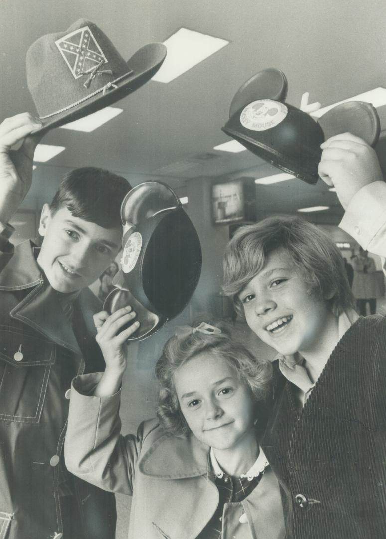 M-I-C, K-E-Y ? M-O-U-S-E!, And it's back from their Disneyland trip for 12-year-old Star carrier boys Bobby Tuck (left) and Joey LoVecchio (right), an(...)