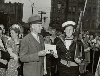 Jimmie Cramer, One of the stalwart guards of the Royal Canadian Naval display in front of the city hall during the recent Victory Loan drive was Jimmi(...)