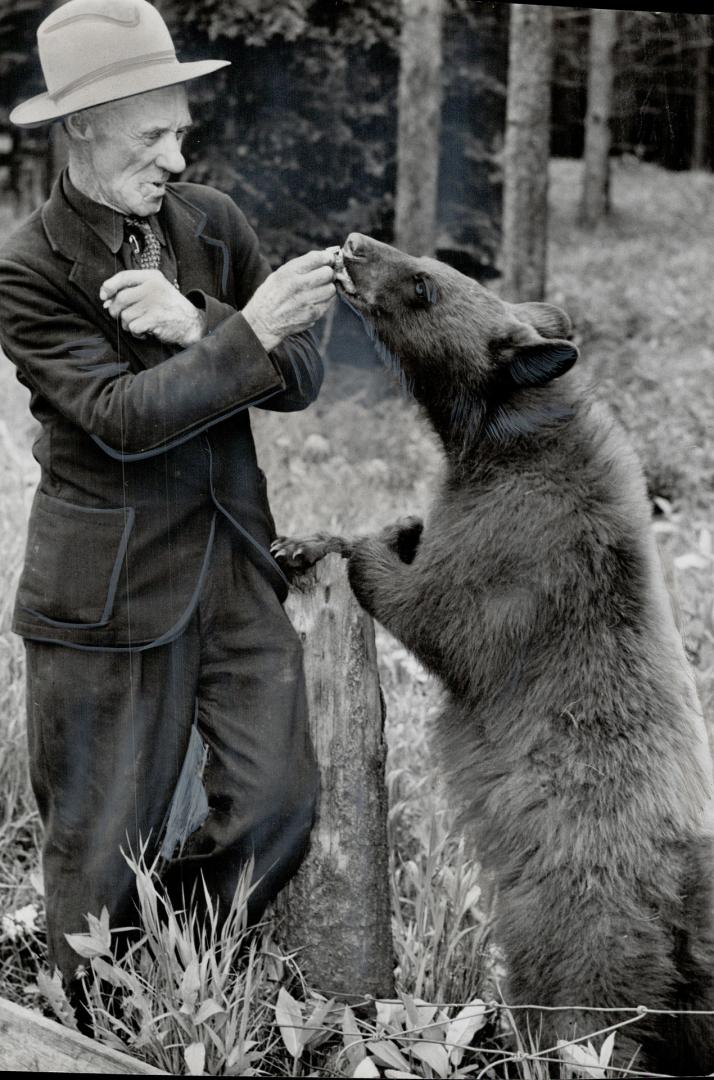 Park attendant Benny Lynch and cub