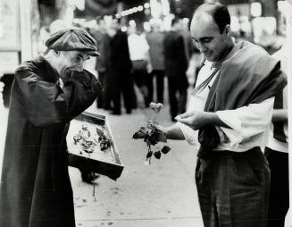 Rose seller in action, illustrting picture Yonge St