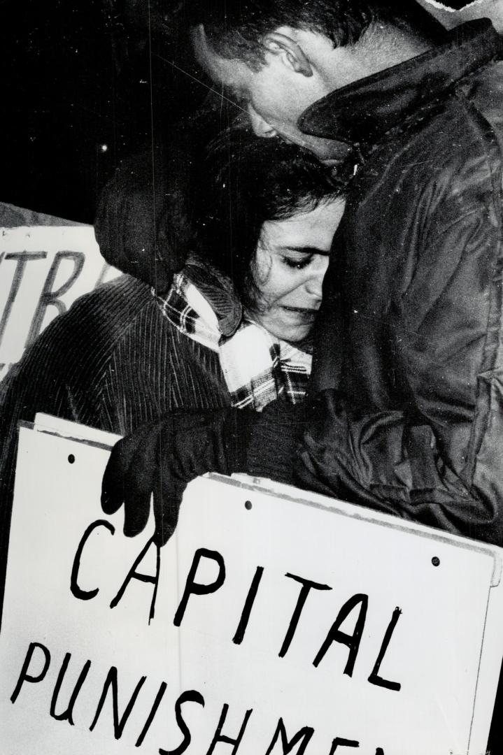 Crying girl during capital punishment demonstrations outside Don Jail at double hanging