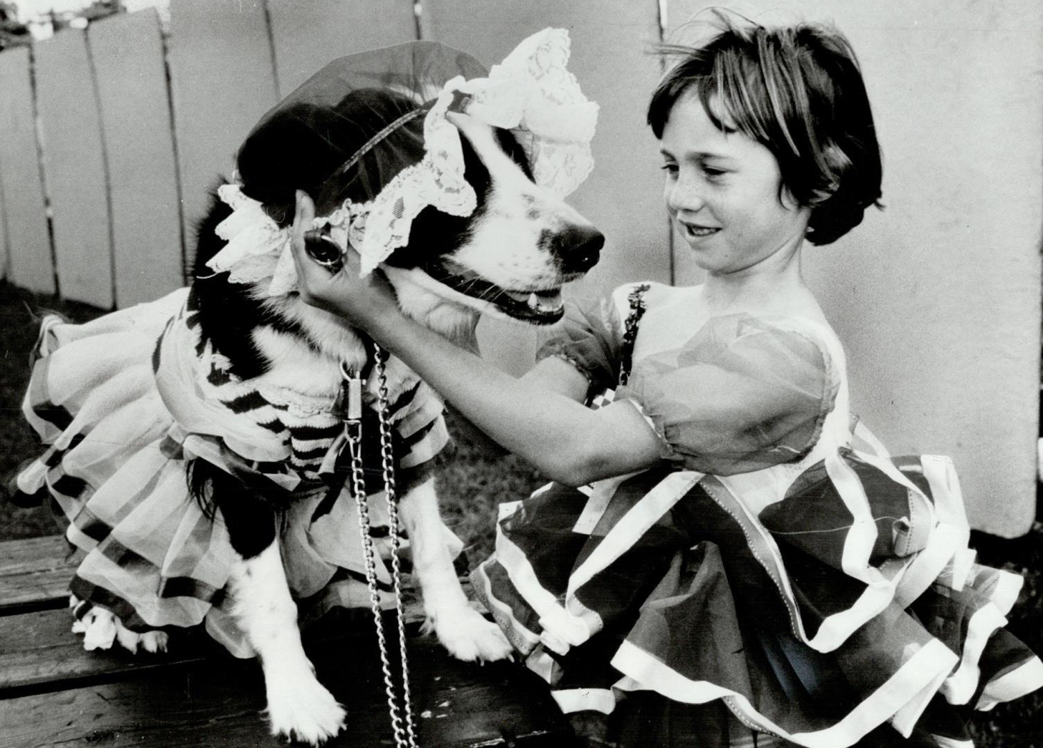 Dance, ballerinas, dance: Buttons is cute as a button and so is owner Cathy Gummerson, 6, of Whitby who made the dog's dress from one of her old dancing outfits