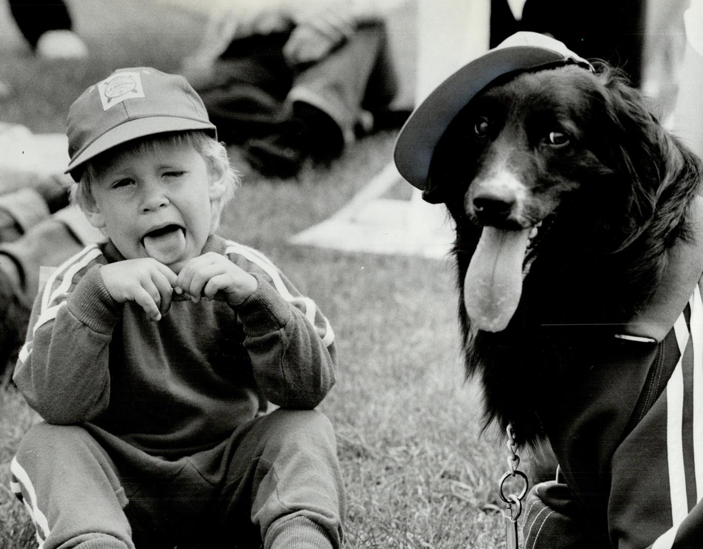 Panting duo: Dale Kahler, 3 1/2, and his mutt, Lady, were both long in the tongue at yesterday's Star Mutt Show held at Harbourfront's Bathurst Quay