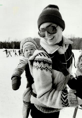 A free ride: Andrew Harvey gets around the Metro zoo on father Dan's back