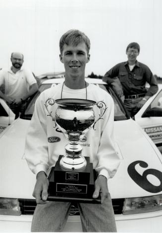 Trophy in hand, Darin Cosgrove of Brockville beams after besting 11 competitors to take road crown, Fast Lane