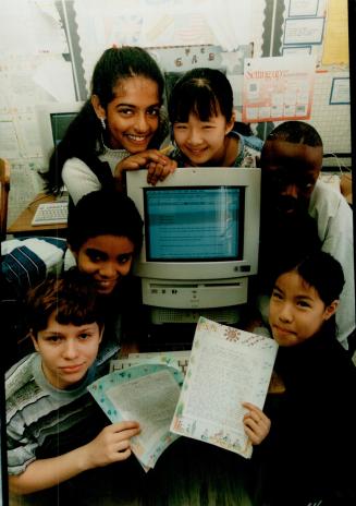 Budding young journalists: Clockwise from bottom left are, Alexei Antonov, Garri Stuart, Dinoba Kirupananthan, Hao Sun, Tess Sowunmi and Caroline Tran