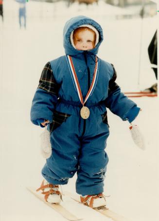 Skiing was a tangled affair for youngster, left, but Sarah Goldman, 2, of Burlington earned medal in first timers' race