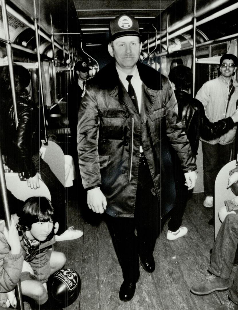 Subway secure: Metro police Constable Alexander Zaychuk patrols the subway from Finch station last night, as did hundreds of officers from Metro, the OPP, RCMP, and other forces