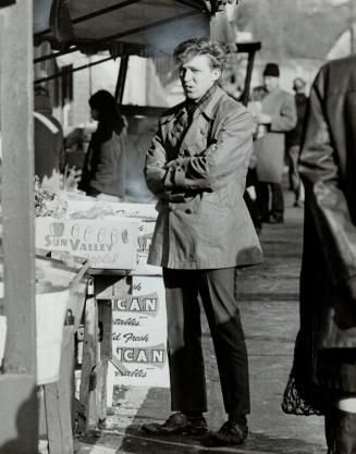 Thomas Wade Borden, who is on probation on a charge of breaking and entering, returns to the scene of the crime for the photographer. [Incomplete]