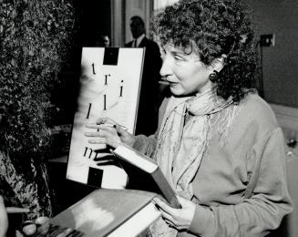 Autographs please: Author Margaret Atwood signs copies of her book Wilderness Tips last night after returning from France to receive Ontario's top literary prize