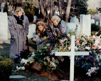 Yolanda Ballard, right, who was banned from Harold Ballard's funeral yesterday, pays her respects later in the day at an Etobicoke cemetery. Ballard's(...)