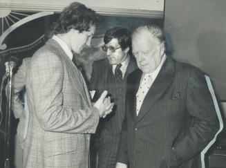 Darryl Sittler, left, AI Eagleson, and Harold Ballard, right, fired first shots of the great Ronald McDonald battle Wednesday