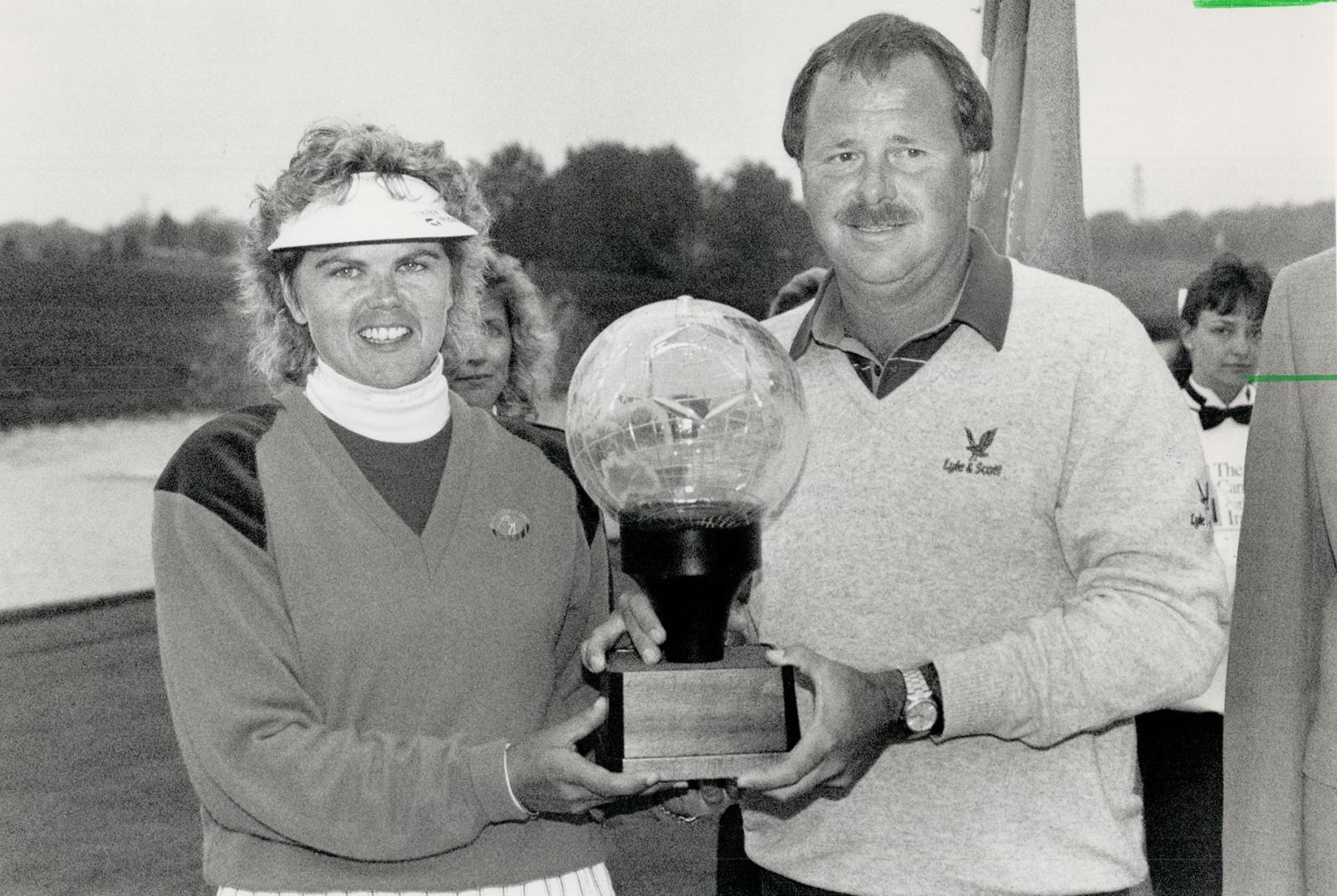 What a team! Canadian golfers Dawn Coe and Dave Barr, fourth after the opening round, came storming back yesterday and won the Canadian Airlines Inter(...)