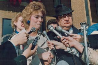 End of an ordeal: Debbie Bastien cries as she talks to reporters after an inquest into the death of her husband, who was shot outside his Windsor-area home by Opp