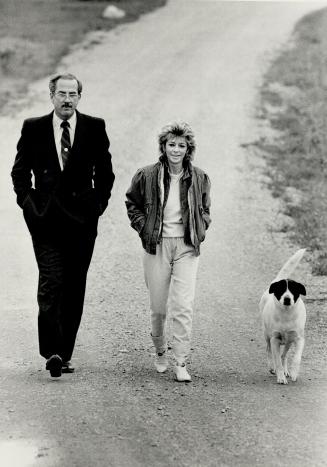 Detective William Dear and Diane Beckon discuss the case as they walk the family dog