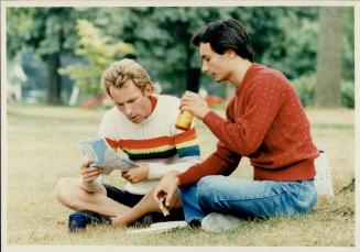 Taking a break: Richard Beecroft, left, chats with Duncan Meyer, 22, who has been helping Beecroft with his trip since April by driving a 22-foot motorhome with flashing lights behind him