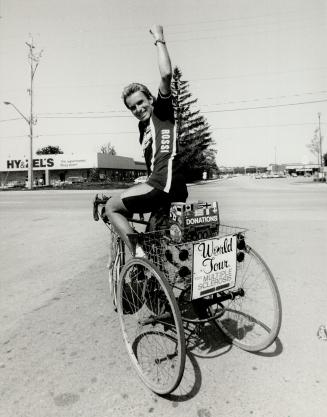 Almost home: Richard Beecroft of Ottawa was to ride his tricycle into Metro today, three years after he started his world cycling tour to heighten awareness of muscular sclerosis