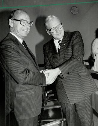 Rowland Frazee (left), chairman of the Royal Bank, congratulates Dr. Gordon Bell as he presents him with the $100,000 Royal Bank Award for Canadian Achievement.