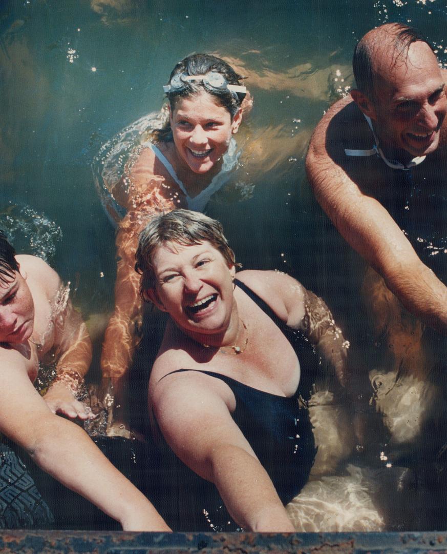 Marilyn Bell Di Lascio, 49, the first person to swim Lake Ontario, and daughter Jodi, 24, take part in yesterday's relay swim for Variety Village. Story, page A18