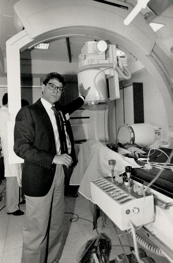 Heart of the matter: Dr. Lee Benson explains the sophisticated new heart monitoring machine yesterday at the Hospital for Sick Children