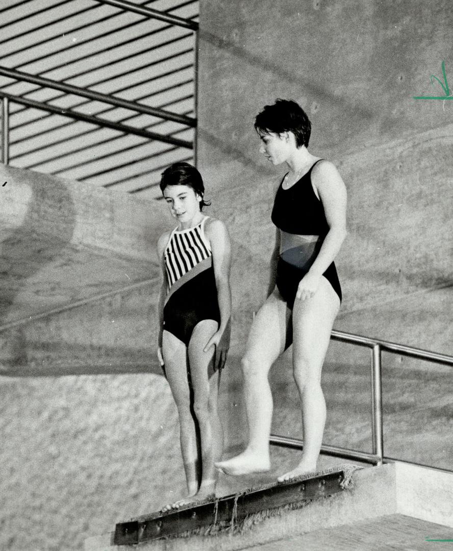 Tips from an Olympian. Olympic gold-medal diver Sylvie Bernier, doing the CTV show Thrill Of A Lifetime, gives some help yesterday to nervous-looking (...)