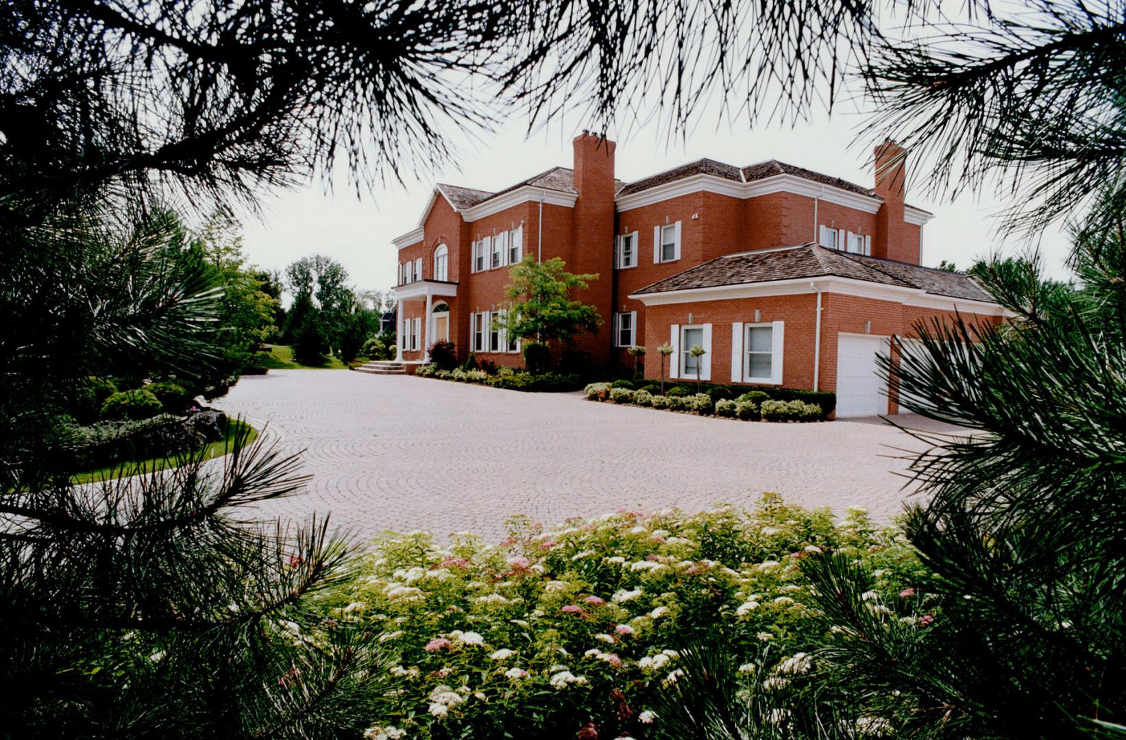 Image shows a two storey residential house.