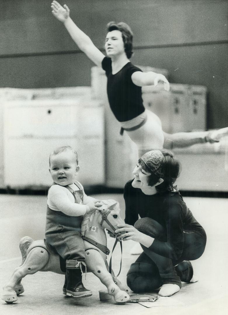 Adrian, 17 months is the ham in the family on his rocking horse while mom, ballerina Victoria Bertram of the National Ballet, is the admiring audience(...)