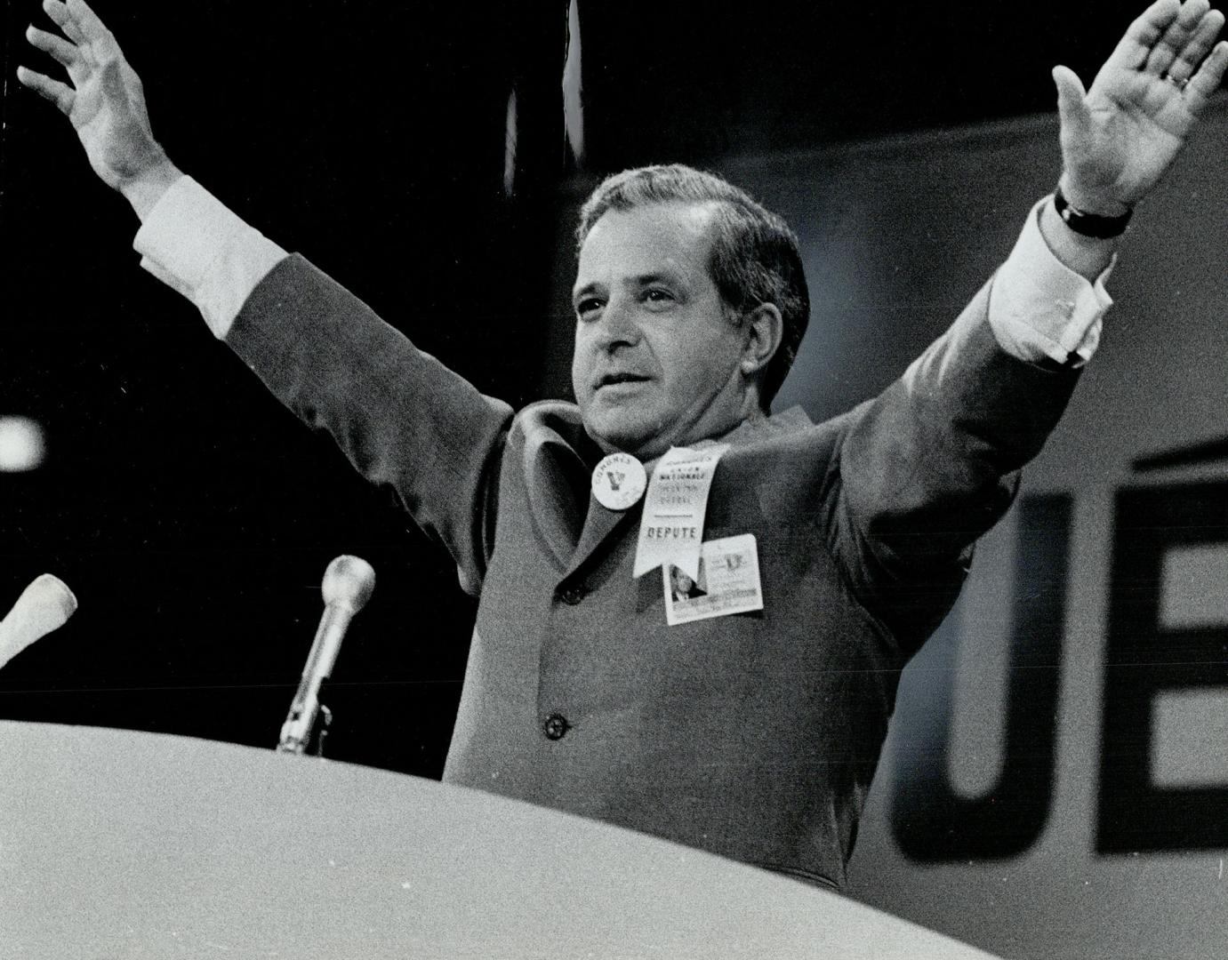 Arms spread wide, Quebec Premier Jean-Jacques Bertrand acknowledges cheering after he was confirmed Union Nationale leader in Quebec city Saturday