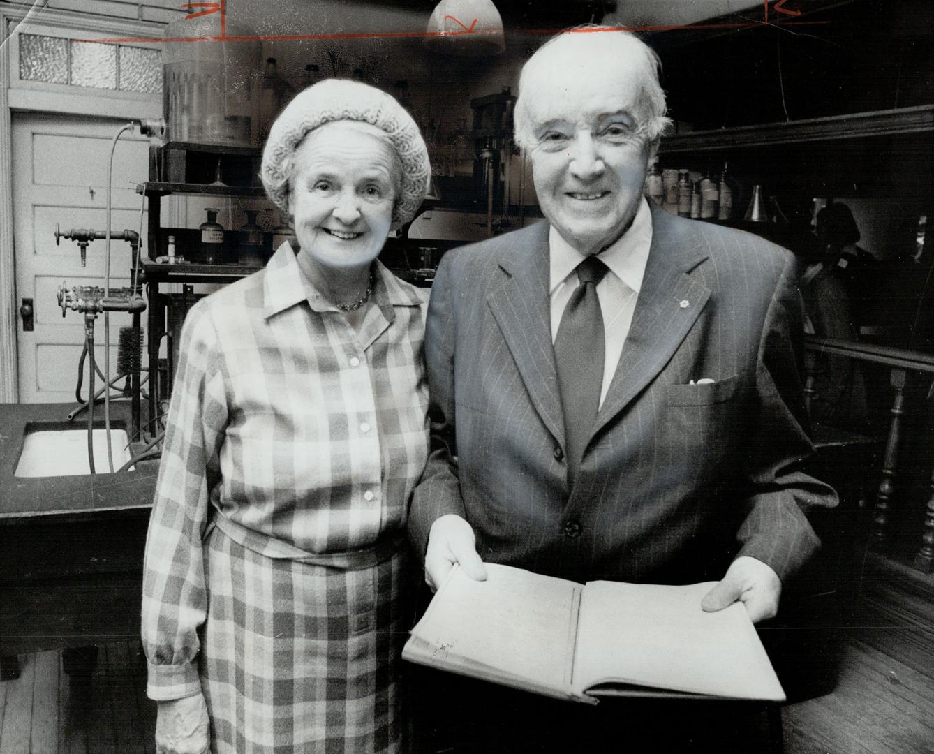 Co-discoverer of insulin, Dr. Charles H. Best, 77, and his wife look over notes last night he and Sir Frederick Banting compiled during their reseach.(...)