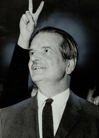 V for victory: A jubilant student makes a victory sign behind Claude Bissell after the U of T president agreed to give students bigger voice in campus discipline